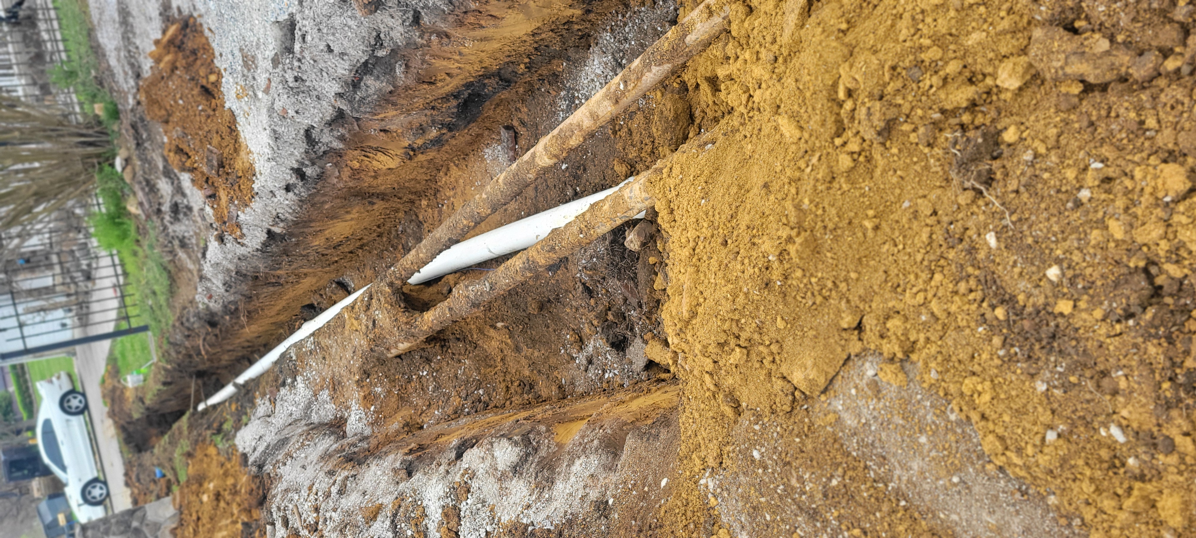 Pipe installation along a residential property